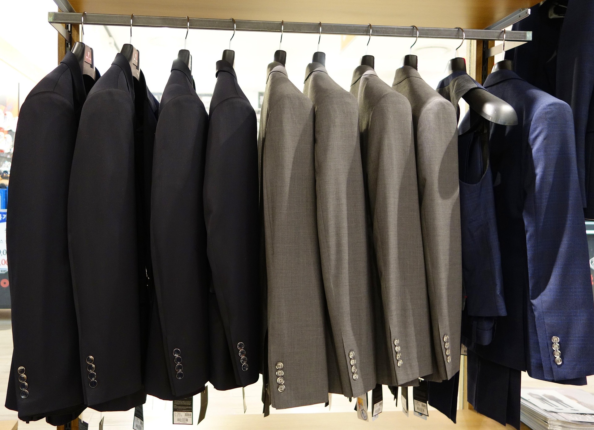 clothing rack displaying fancy men's clothes