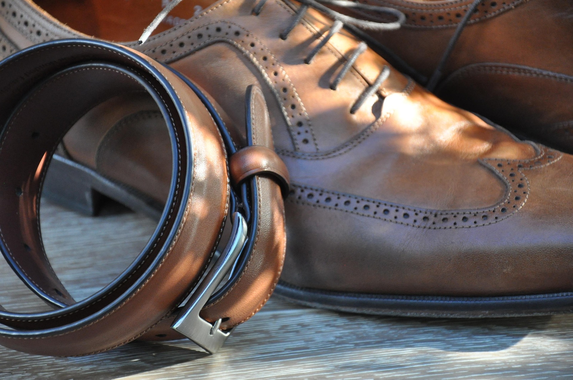 brown leather shoes and belt
